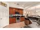 Close-up of kitchen showcasing stainless steel appliances, granite countertops, and wood cabinetry at 5423 W Range Mule Dr, Phoenix, AZ 85083