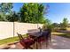An outdoor patio featuring a dining table and chairs, perfect for enjoying outdoor meals at 5423 W Range Mule Dr, Phoenix, AZ 85083