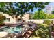 A private in-ground pool with beautiful landscaping, perfect for relaxing and entertaining outdoors at 5423 W Range Mule Dr, Phoenix, AZ 85083