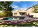 A private in-ground pool with beautiful landscaping, perfect for relaxing and entertaining outdoors at 5423 W Range Mule Dr, Phoenix, AZ 85083
