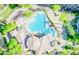 Aerial view of the pool and deck area surrounded by lush landscaping at 5450 E Deer Valley Dr # 3003, Phoenix, AZ 85054