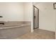 Bathroom features soaking tub and glass door shower at 5450 E Deer Valley Dr # 3003, Phoenix, AZ 85054