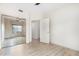 The bright bedroom features mirrored closet doors and light flooring with a white door open at 5450 E Deer Valley Dr # 3003, Phoenix, AZ 85054