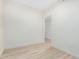 This bedroom has light colored flooring, white walls, base trim and an open doorway at 5450 E Deer Valley Dr # 3003, Phoenix, AZ 85054