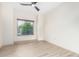 Spacious room boasts light colored flooring, white walls, a ceiling fan, and a view from the window at 5450 E Deer Valley Dr # 3003, Phoenix, AZ 85054