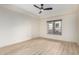 Spacious bedroom has light wood flooring and a window with nice natural light at 5450 E Deer Valley Dr # 3003, Phoenix, AZ 85054