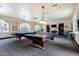 Community billiards room with pool tables, bar stools, and comfortable seating area at 5450 E Deer Valley Dr # 3003, Phoenix, AZ 85054