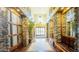 Grand hallway with decorative stone pillars, tiled floors, and seating, leading to glass doors at 5450 E Deer Valley Dr # 3003, Phoenix, AZ 85054