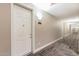 Apartment hallway with neutral walls, decorative lighting, and carpeted floors, leading to door number 3003 at 5450 E Deer Valley Dr # 3003, Phoenix, AZ 85054