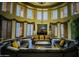 Cozy living room featuring comfortable seating, many windows, and a mounted television at 5450 E Deer Valley Dr # 3003, Phoenix, AZ 85054