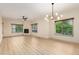 Bright living room features wood flooring, fireplace, ceiling fan and recessed lighting at 5450 E Deer Valley Dr # 3003, Phoenix, AZ 85054