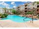 Community pool with ample seating and landscaping in the background at 5450 E Deer Valley Dr # 3003, Phoenix, AZ 85054