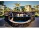 Stone water feature in a landscaped community with several buildings in the background at 5450 E Deer Valley Dr # 3003, Phoenix, AZ 85054