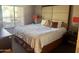 Cozy bedroom with a king-size bed, neutral color palette, and views of the outdoor balcony at 5450 E Deer Valley Dr # 3183, Phoenix, AZ 85054