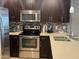 Modern kitchen showcasing stainless steel appliances, sleek cabinetry, and ample counter space at 5450 E Deer Valley Dr # 3183, Phoenix, AZ 85054