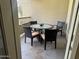 Outdoor patio with a glass-topped table and four chairs at 5450 E Deer Valley Dr # 3183, Phoenix, AZ 85054