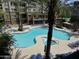 Stunning pool area with lounge chairs, palm trees, and a jacuzzi at 5450 E Deer Valley Dr # 3183, Phoenix, AZ 85054
