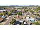 Wide aerial view of a residential neighborhood with tree-lined streets, diverse home styles, and mountain views at 6111 N 8Th St, Phoenix, AZ 85014