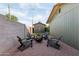 A backyard with a fire pit area with chairs and a gravel base, as well as a storage shed at 6111 N 8Th St, Phoenix, AZ 85014