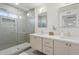 Modern bathroom featuring a double vanity, sleek fixtures, and a glass-enclosed shower at 6111 N 8Th St, Phoenix, AZ 85014