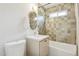 Well-lit bathroom with a shower/tub combo, decorative tile, and sleek fixtures at 6111 N 8Th St, Phoenix, AZ 85014