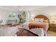 A spacious bedroom with ample natural light, modern furnishings, and a seating area at 6111 N 8Th St, Phoenix, AZ 85014