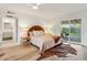 Bright bedroom with a sliding glass door to the patio and modern decor at 6111 N 8Th St, Phoenix, AZ 85014