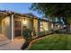 Charming home exterior featuring a well-manicured lawn and mature trees at 6111 N 8Th St, Phoenix, AZ 85014