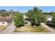 Inviting home featuring mature trees and a lush, green front yard at 6111 N 8Th St, Phoenix, AZ 85014