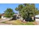 Charming home with a well-manicured lawn and mature trees, enhancing curb appeal at 6111 N 8Th St, Phoenix, AZ 85014