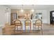Stylish kitchen with counter seating, stainless steel appliances, and hardwood floors at 6111 N 8Th St, Phoenix, AZ 85014