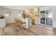 Stylish kitchen with a center island, bar stools, and sliding glass doors leading to an outdoor patio at 6111 N 8Th St, Phoenix, AZ 85014