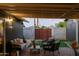 A cozy covered patio with brick flooring and outdoor seating that offers a relaxing backyard view at 6111 N 8Th St, Phoenix, AZ 85014