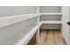 Built-in storage featuring ample shelving and wood-look floors at 6111 N 8Th St, Phoenix, AZ 85014