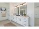 Modern bathroom featuring dual sinks, quartz countertops, and modern black hardware at 6514 W Apex Ave, Queen Creek, AZ 85144