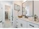 Bright bathroom boasts a large framed mirror and ample vanity storage space at 6514 W Apex Ave, Queen Creek, AZ 85144