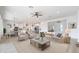 Bright, open-concept living space featuring modern furnishings and hardwood-style flooring at 6514 W Apex Ave, Queen Creek, AZ 85144