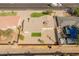 Aerial shot of a fenced property featuring a well-maintained roof and a small green lawn at 6610 N 15Th Ave, Phoenix, AZ 85015