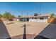 A spacious backyard featuring gravel and a privacy fence at 6610 N 15Th Ave, Phoenix, AZ 85015