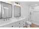 Modern bathroom with dual sinks, updated fixtures, and tiled walk-in shower at 6610 N 15Th Ave, Phoenix, AZ 85015