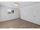 Bright bedroom featuring wood floors, fresh white walls, and ample natural light at 6610 N 15Th Ave, Phoenix, AZ 85015