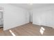 Clean, bright bedroom featuring wood floors, with attached bathroom, and large closet at 6610 N 15Th Ave, Phoenix, AZ 85015
