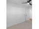 Bright bedroom featuring plush carpet, a ceiling fan, and a closet for ample storage at 6610 N 15Th Ave, Phoenix, AZ 85015