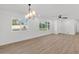Bright, empty room with modern flooring, neutral walls, and large windows offering scenic views at 6610 N 15Th Ave, Phoenix, AZ 85015