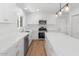 Bright, updated kitchen with white cabinets, stainless steel appliances, and a center island, offering a modern and functional design at 6610 N 15Th Ave, Phoenix, AZ 85015