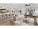 Bright, open-concept living area featuring modern decor and seamlessly flowing into the kitchen at 6610 N 15Th Ave, Phoenix, AZ 85015