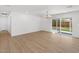 Living room with modern light fixture and sliding glass doors that open to the backyard, offering a bright and airy feel at 6610 N 15Th Ave, Phoenix, AZ 85015