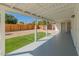 Covered patio overlooking a fenced backyard with fresh gravel and artificial turf at 6610 N 15Th Ave, Phoenix, AZ 85015