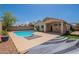 Backyard boasts a private pool, covered patio, and plenty of room for entertaining at 8010 W Adam Ave, Peoria, AZ 85382
