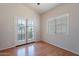Bedroom with French doors to patio and natural light from large window at 8010 W Adam Ave, Peoria, AZ 85382
